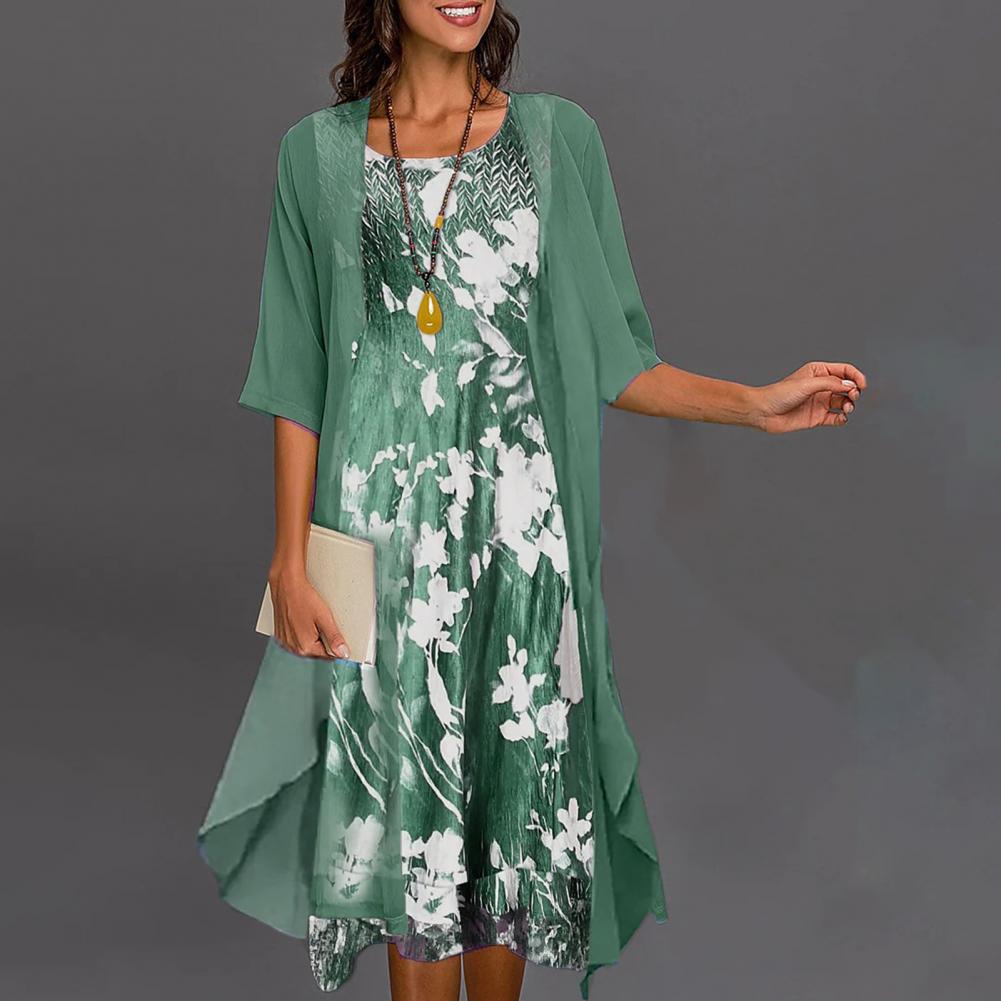 Stijlvolle Théa dames zomerjurk met bloemenprint en bijpassend vest met ronde hals, lange mouwen.