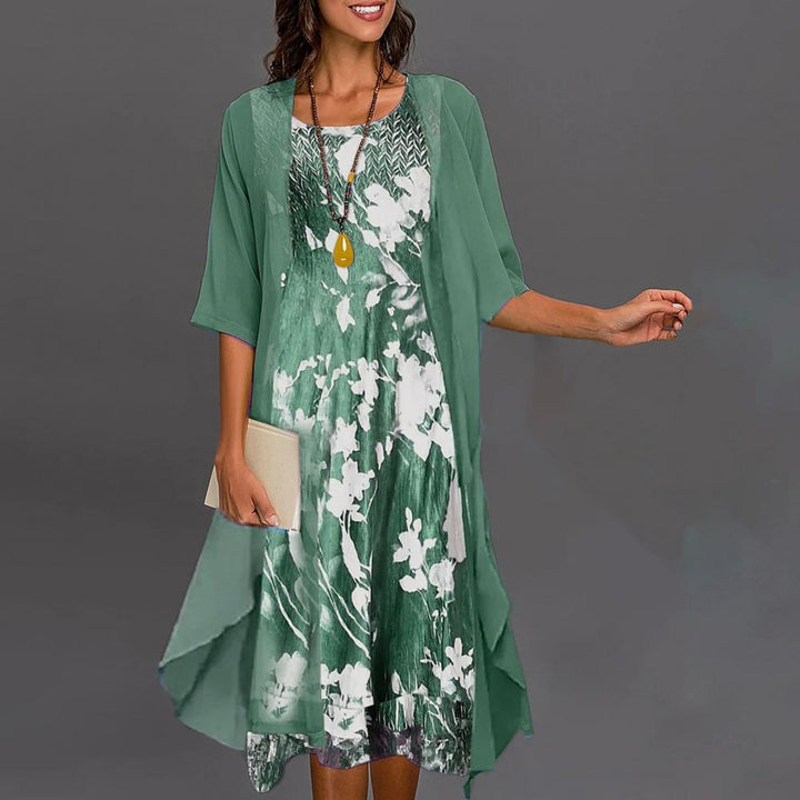 Stijlvolle Théa dames zomerjurk met bloemenprint en bijpassend vest met ronde hals, lange mouwen.