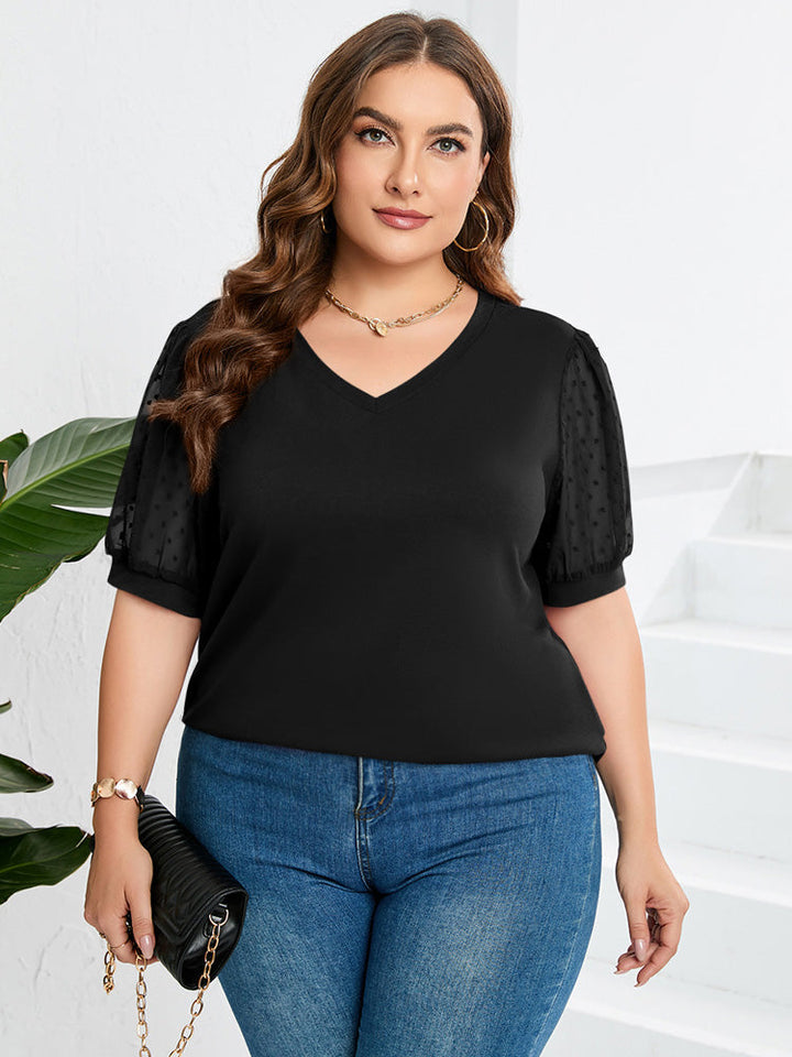 Modieuze lente/zomer dames top met elegante V-hals en korte pofmouwen. Comfortabel en stijlvol.