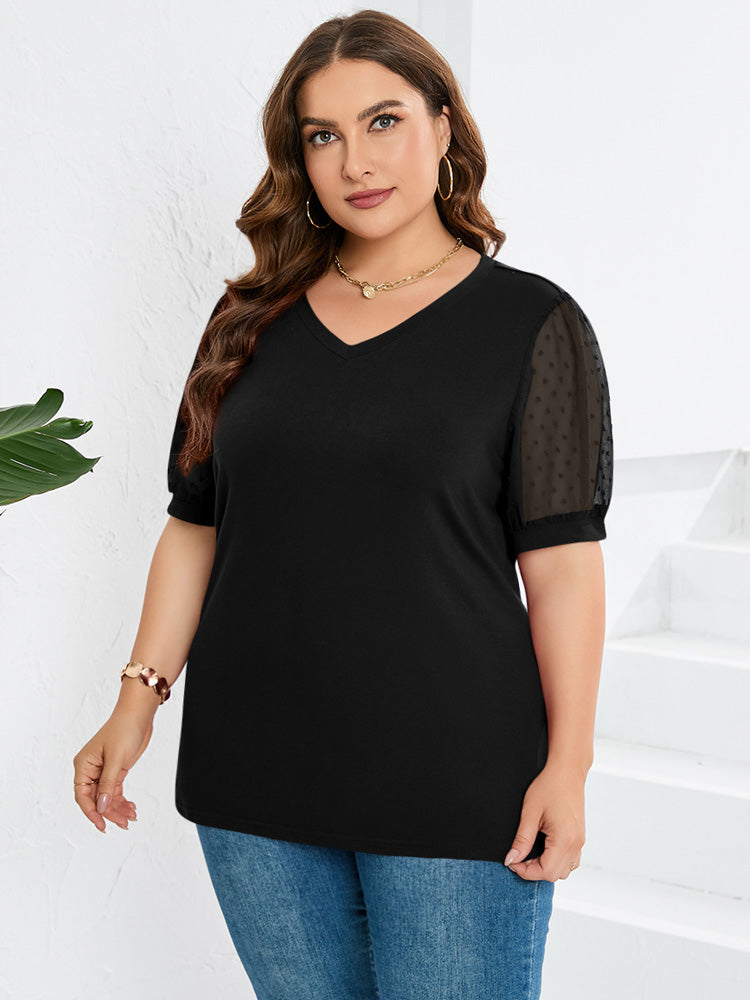Elegante dames top met V-hals en opvallende pofmouwen. Trendy en modieus voor lente/zomer.