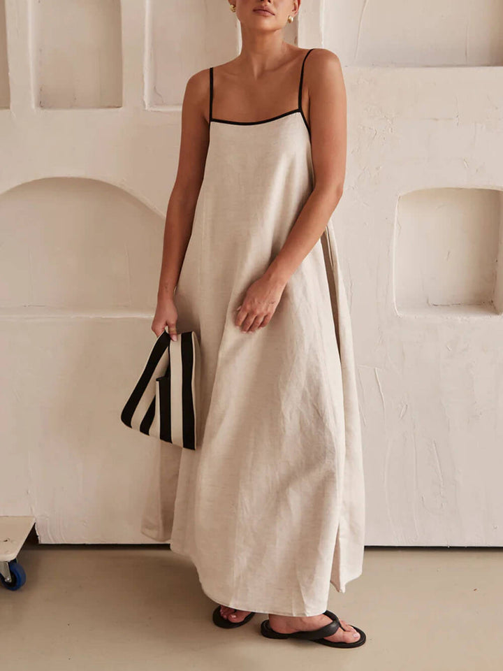 Dames trendy A-lijn feestjurk met elegant contrastdesign. Perfect als zomerjurk of avondjurk met spaghettibandjes.