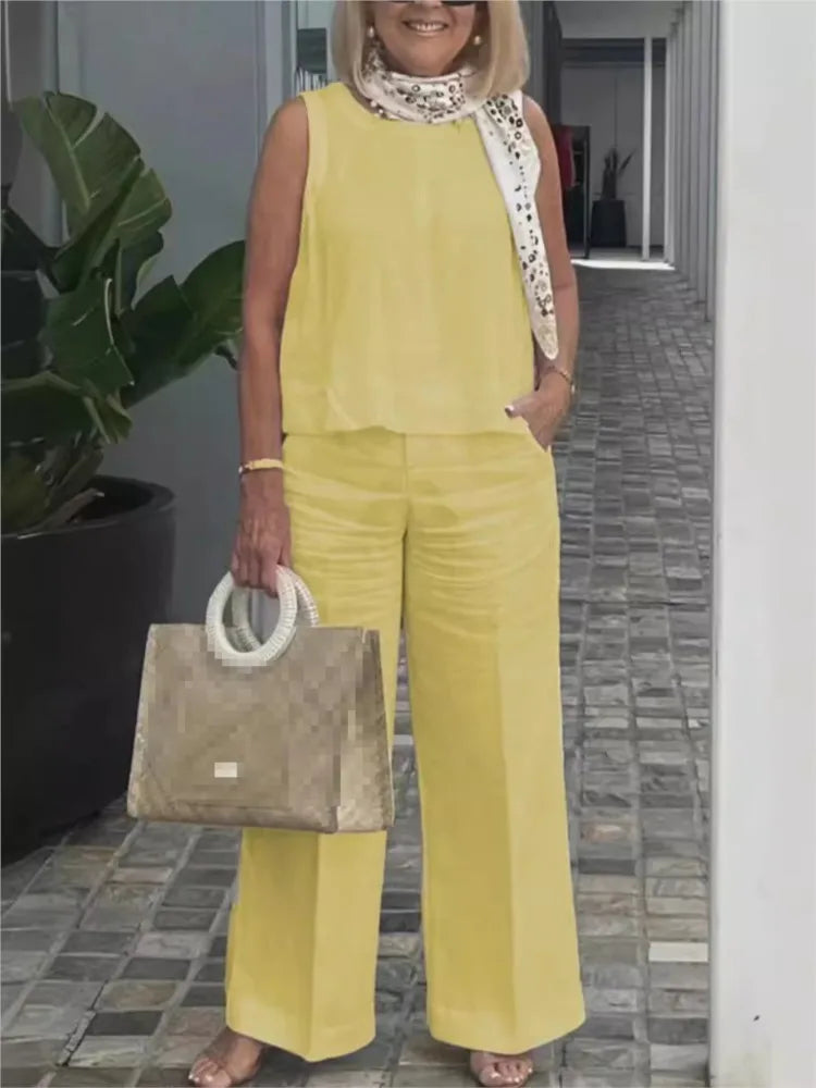 Dames tweedelige linnen zomerset: mouwloze blouse & wijde broek voor een casual zomerstijl.