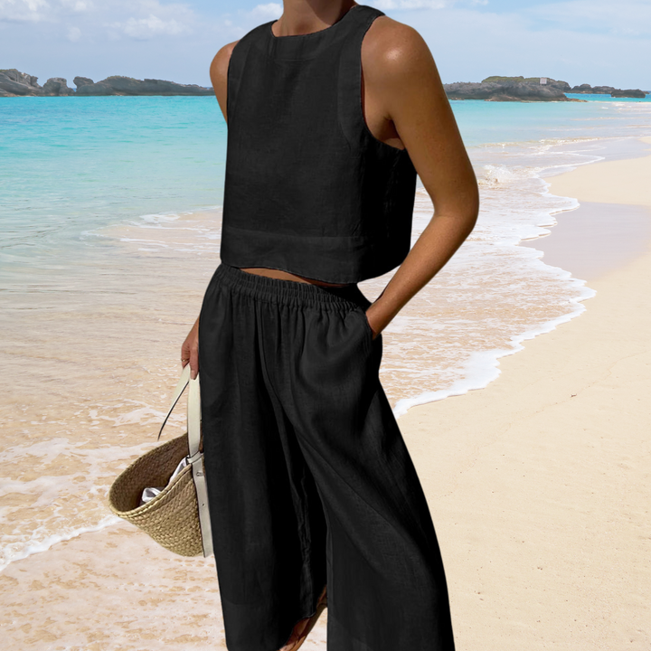 Comfortabele tweedelige dames zomerset van ademende linnen-katoenmix. Stijlvolle crop top & broek met wijde pijpen.