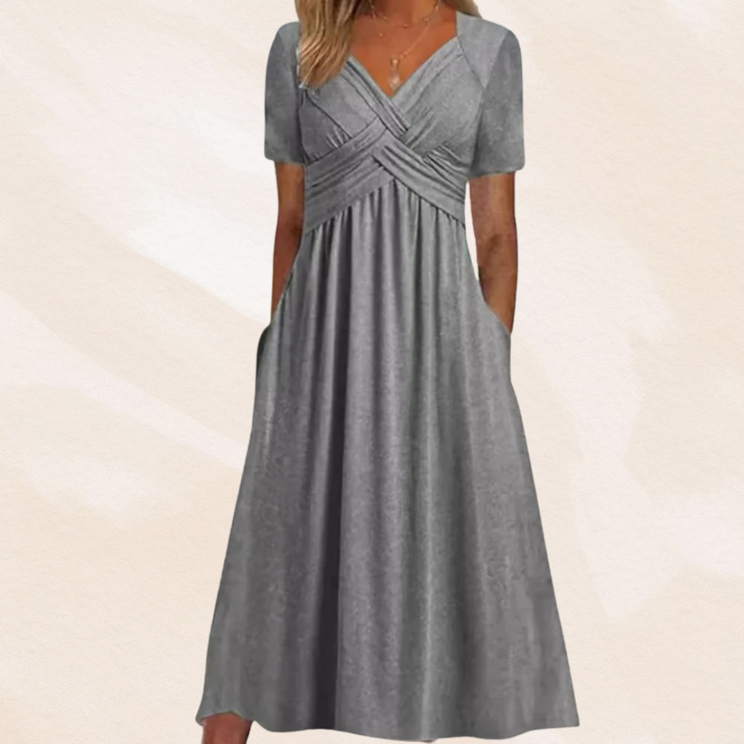Elegante dames midi jurk met diepe V-hals en flatterende A-lijn. Perfecte zomerjurk voor een stijlvolle look.