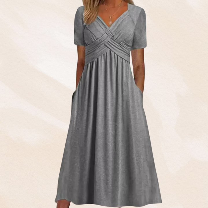 Elegante dames midi jurk met diepe V-hals en flatterende A-lijn. Perfecte zomerjurk voor een stijlvolle look.