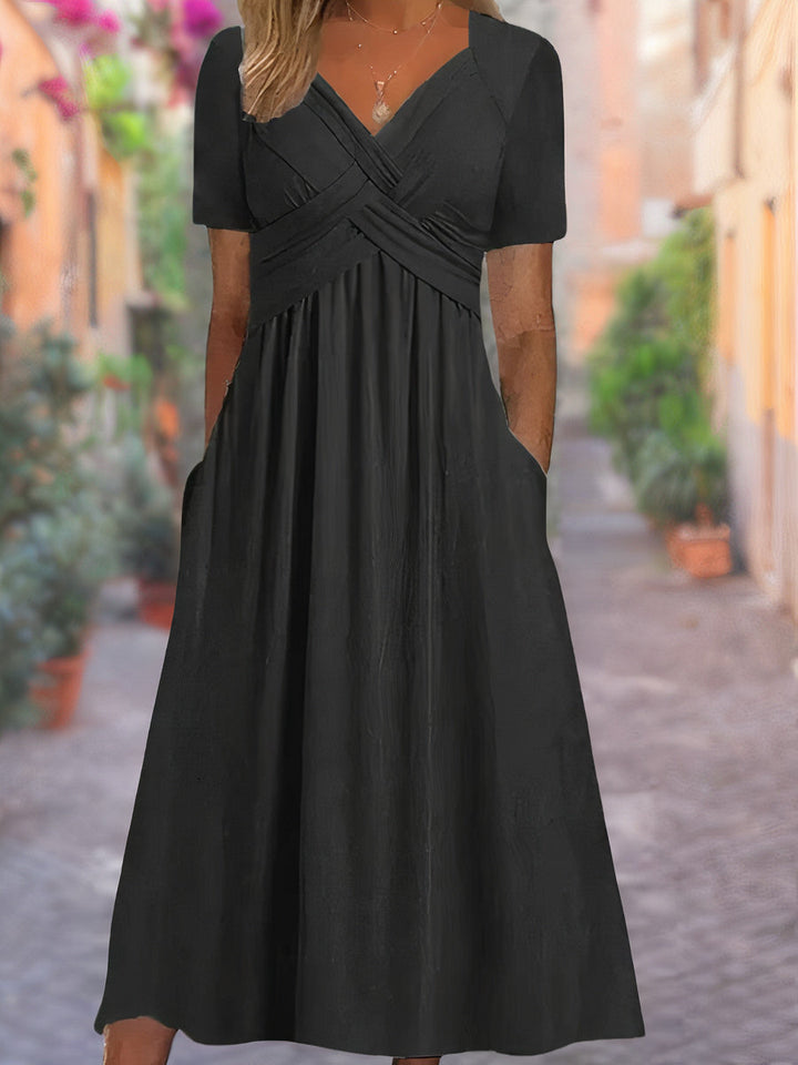 Modieuze dames V-hals zomerjurk, comfortabel en elegant, perfect voor warme dagen en diverse stijlen.