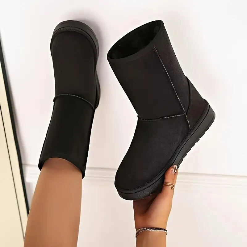 Modieuze Aria dames slip-on winterlaarzen, ideaal voor casual wintermode, met een warme fleecevoering.