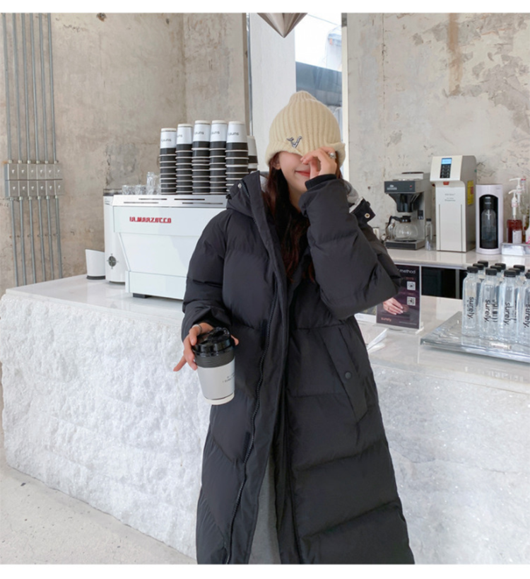 Stijlvolle zwarte Tommy Dons parka voor dames, trendy wintermode.