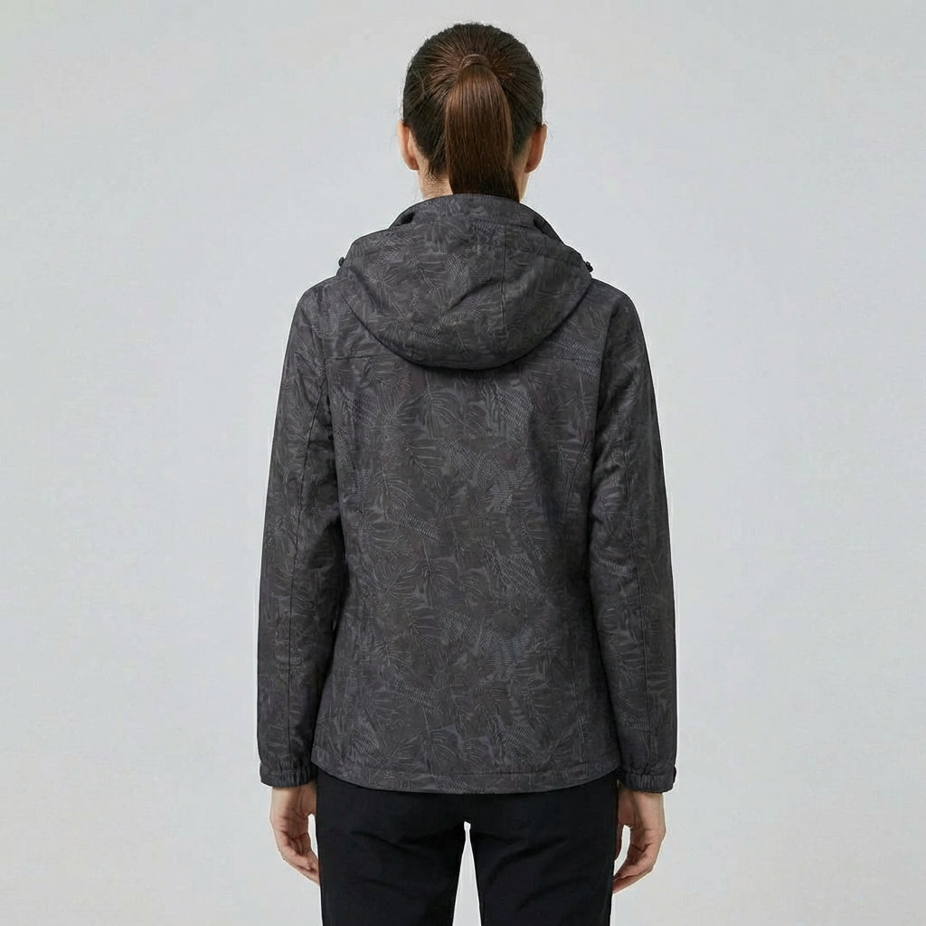 Trendy dames buitenjas met stijlvol bladpatroon. Winddicht, waterdicht en ademend voor comfort.