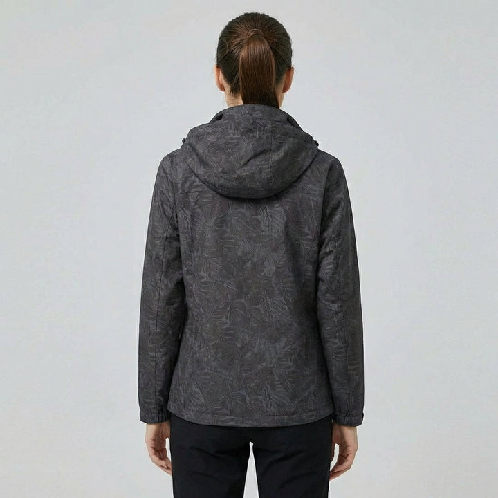 Trendy dames buitenjas met stijlvol bladpatroon. Winddicht, waterdicht en ademend voor comfort.