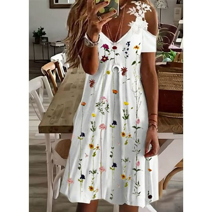 Damesmode FlowerDress™: comfortabele zomerjurk met elegant bloemenpatroon en korte mouwen.