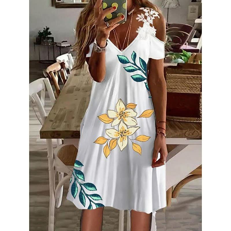 Elegante FlowerDress™ dames zomerjurk met verfijnd bloemendesign, ideaal voor diverse gelegenheden.