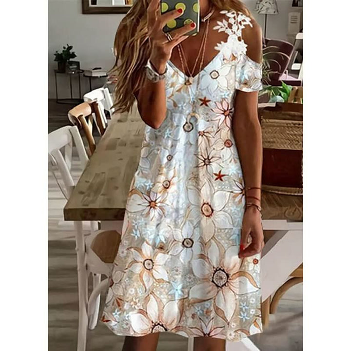 Zachte en luchtige FlowerDress™ zomerjurk met bloemenprint, comfortabel voor de warmste dagen.