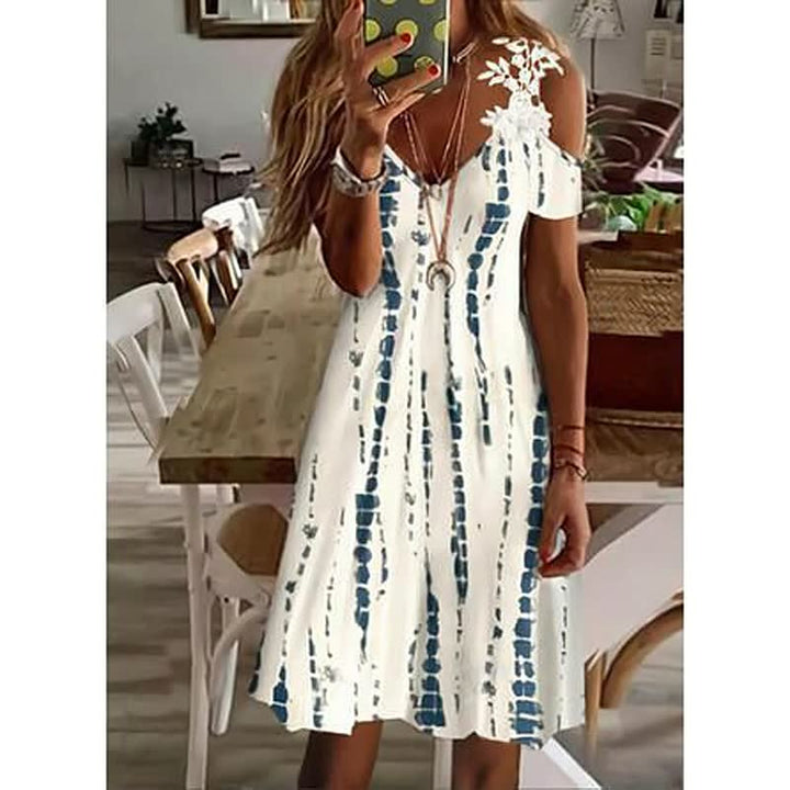 Kleurrijke FlowerDress™ zomerjurk voor dames met vrolijk bloemendesign, comfortabel en stijlvol.