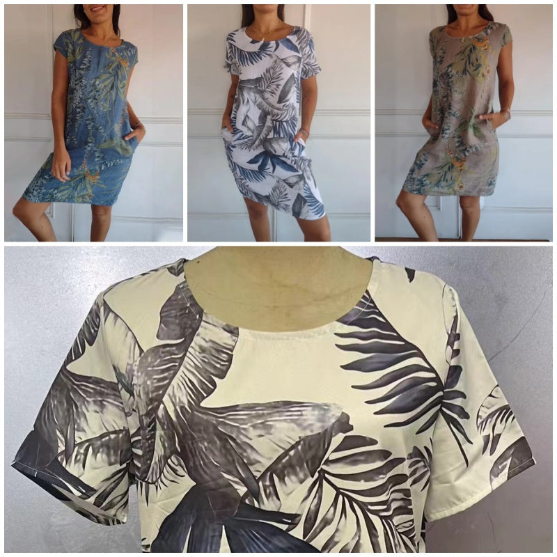 Modieuze damesjurk met levendige bloemenprint, ronde hals en korte mouwen. Perfect voor vakantie.