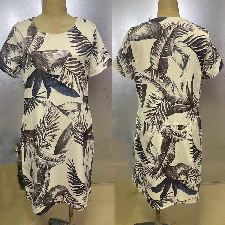 Elegante dames feestjurk met bloemenprint en ronde hals. Een stijlvolle keuze voor speciale gelegenheden.