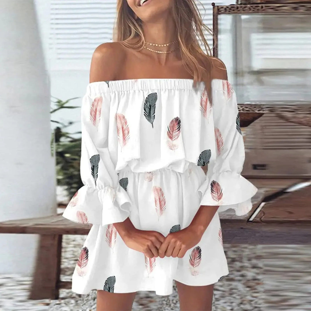 Dames zomerjurk Mireille met kleurrijke bloemenprint en trendy uitlopende mouwen, perfect voor een casual look.