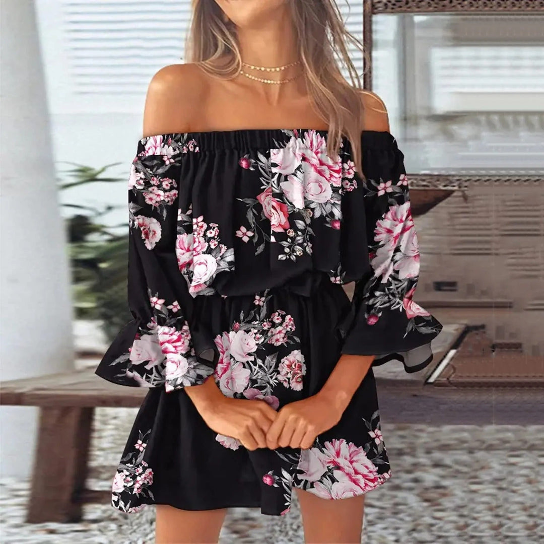 Elegante dames zomerjurk met vrolijke bloemenprint, v-hals en luchtige uitlopende mouwen voor een bohemien stijl.