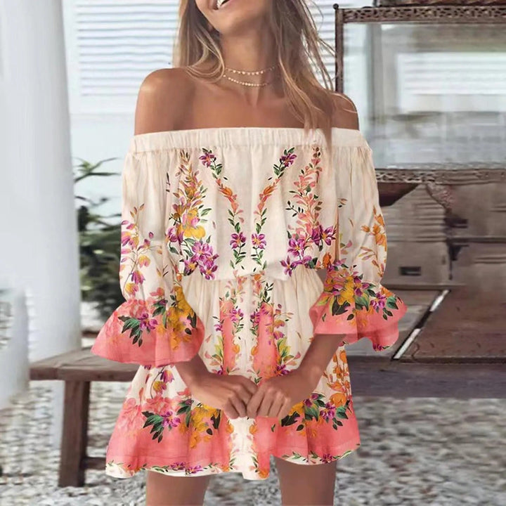 Trendy dames zomerjurk met opvallende bloemenprint, v-hals en chique uitlopende mouwen voor een stijlvolle zomer.