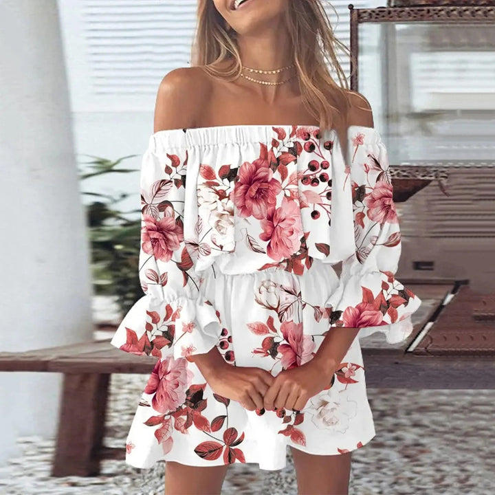 Vrolijke dames zomerjurk met gedetailleerde bloemenprint en uitlopende mouwen, geschikt voor casual en feestjes.