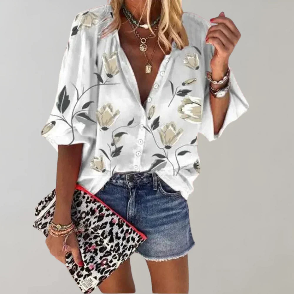 Trendy Hoymans dames blouse met levendige bloemenprint. Een chique en comfortabele zomerse top.