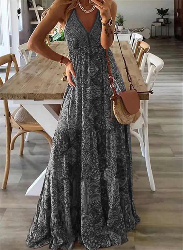 Mouwloze dames boho maxi jurk met bloemenprint, ideaal als zomerjurk of strandjurk. Comfortabel en stijlvol.