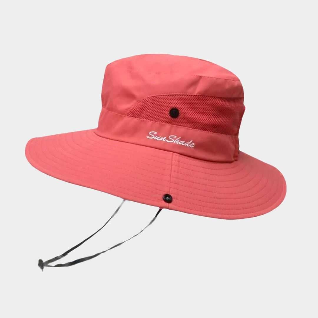 Ademende dames strandhoed met brede rand voor UV-bescherming. Comfortabel en modieus zomeraccessoire.