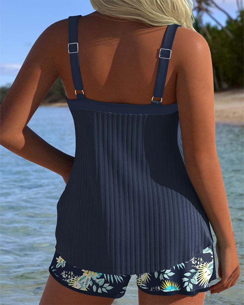 Achterkant van de marineblauwe Luna tankini set, met verstelbare schouderbandjes.