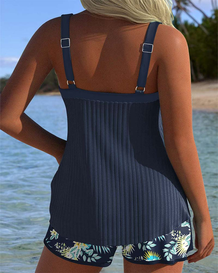Achterkant van de marineblauwe Luna tankini set, met verstelbare schouderbandjes.