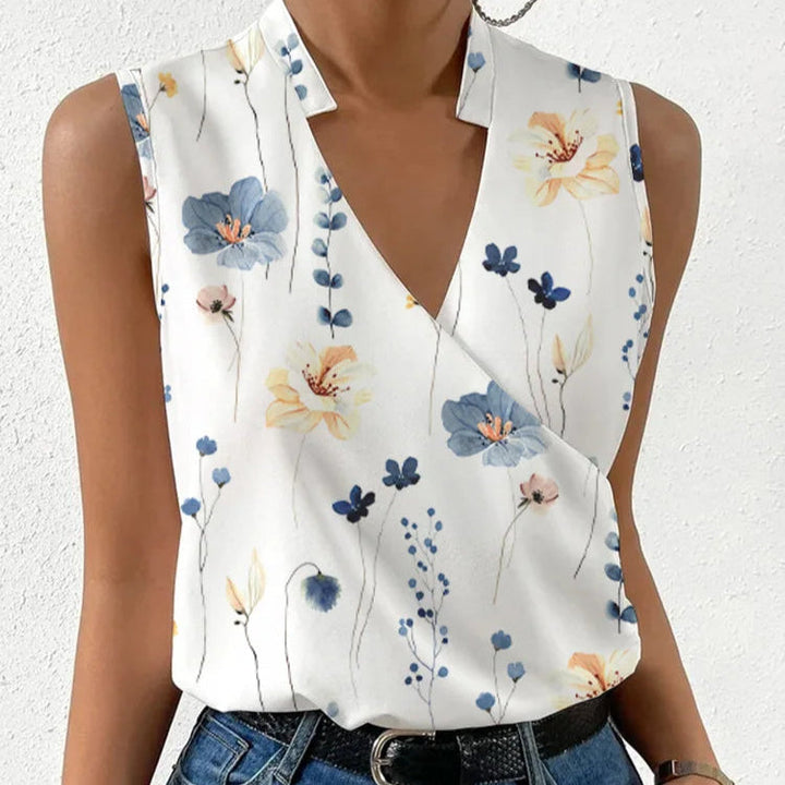 Elegante damestop met vrolijke bloemenprint, mouwloos en comfortabel voor een zomerse look.