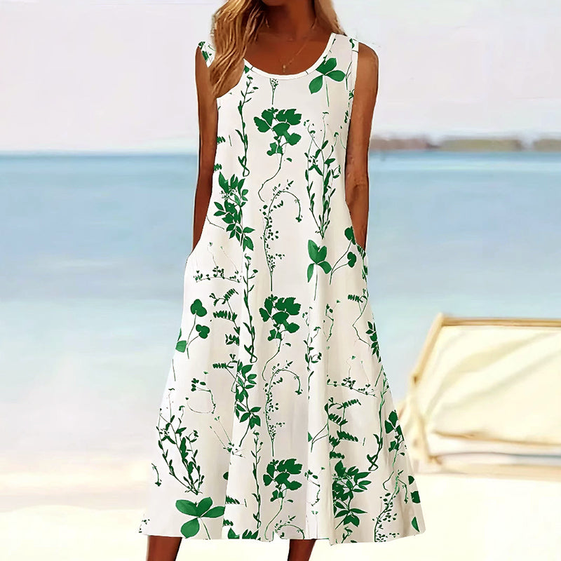 Stijlvolle dames midi jurk in A-lijn model, mouwloos met fleurige bloemenprint, ideaal als elegante zomerjurk.