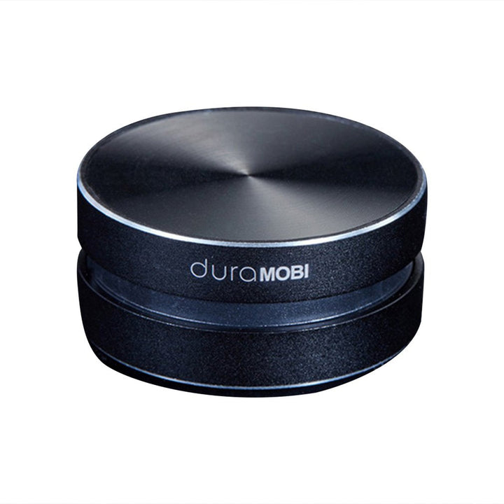 Detailfoto van de innovatieve AnythingSpeaker bluetooth luidspreker, toont compact design en vibratietechnologie.