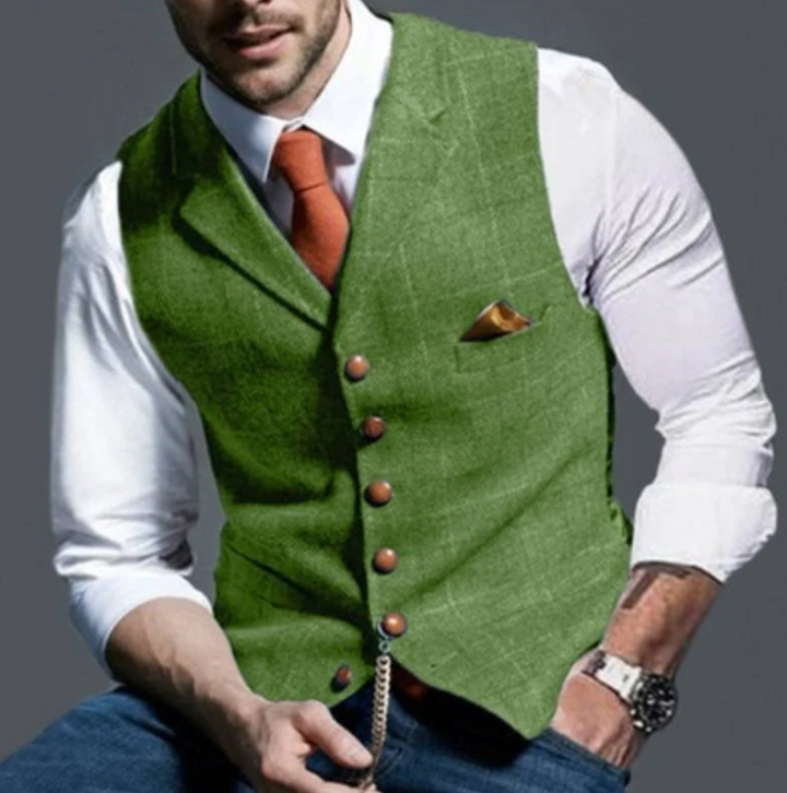 "Elegant donkergrijs herengilet van tweedstof, klassiek en veelzijdig, ideaal voor zowel formele als casual gelegenheden."