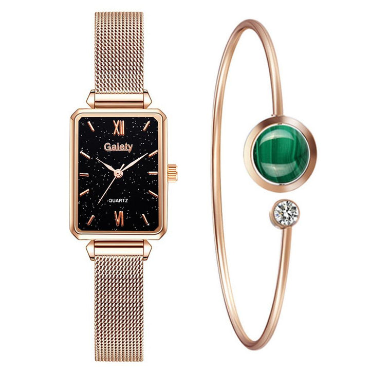 Rechthoekig dameshorloge met gouden schakelarmband, een chique mode-item.