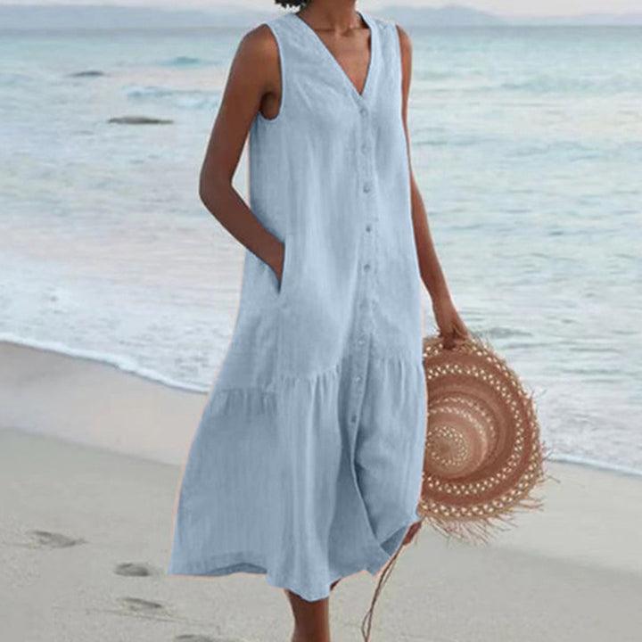 Elegante A-lijn midi-jurk voor dames met decoratieve knoopjes, perfect voor zomerse dagen.