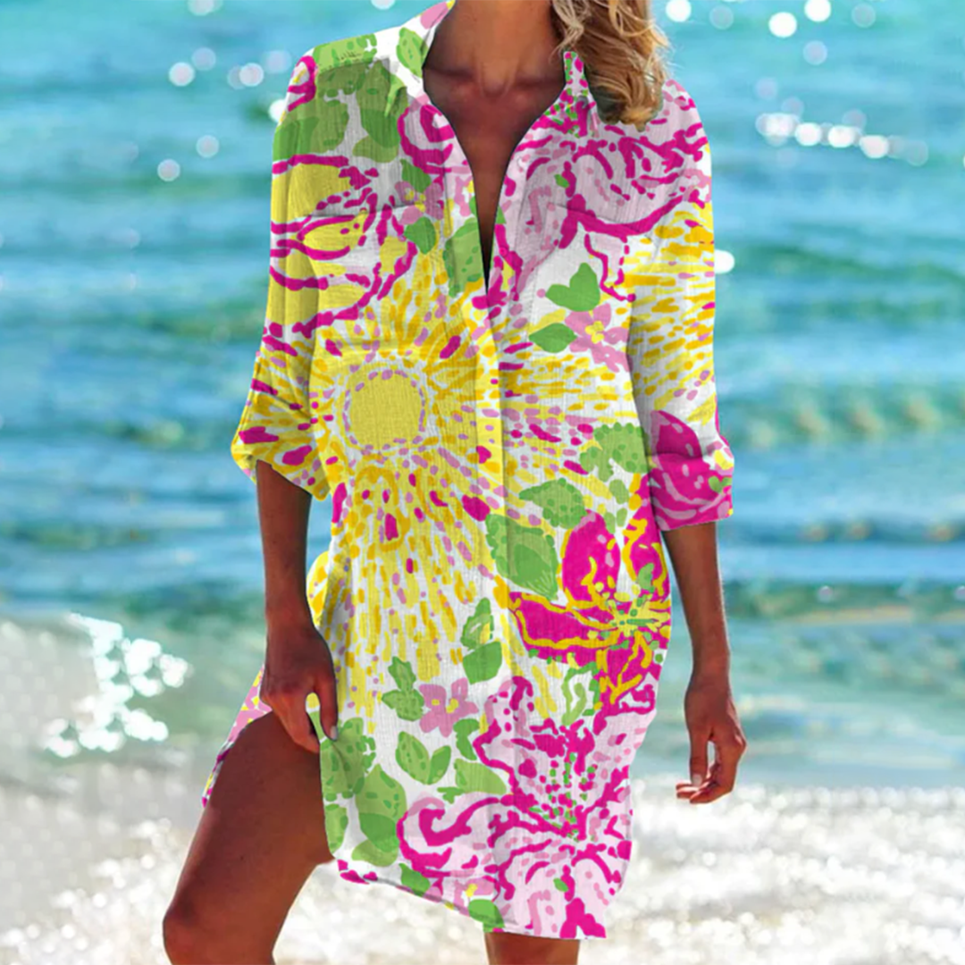 Strandjurk dames: lichte A-lijn zomerjurk met bloemenprint. Ideaal voor vakantie, strand of een casual zomerse dag.
