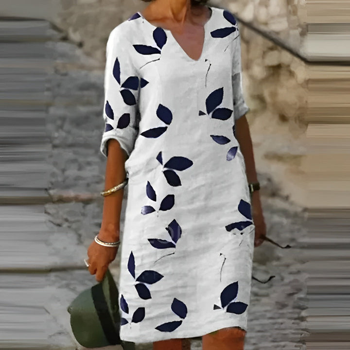 Elegante dames bloemen midi jurk met V-hals en 3/4 mouwen, perfect voor een stijlvolle lente- of zomerlook.
