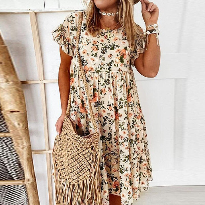 Elegante dames boho bloemenjurk met ruches en taillesnit, perfect als midi zomerjurk of casual lentejurk.