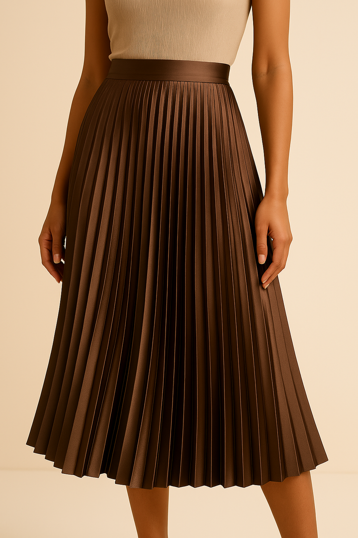 Vloeiende midi damesrok met satijnen plissé en hoge taille, creëert een elegant silhouet.