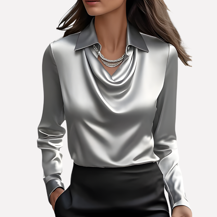 Zeer chique damesblouse met gedrapeerde kraag en lange mouwen. Ideaal voor een verfijnde look.