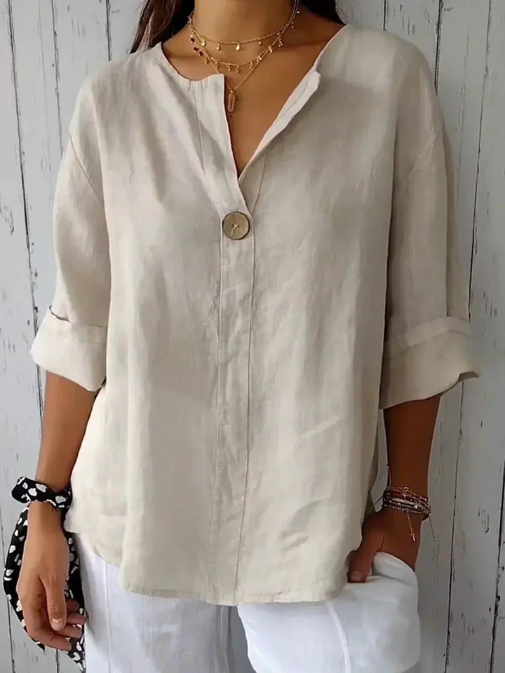 Elegante damesblouse met knoopsluiting en V-hals, ideaal voor een stijlvolle en comfortabele voorjaarslook.