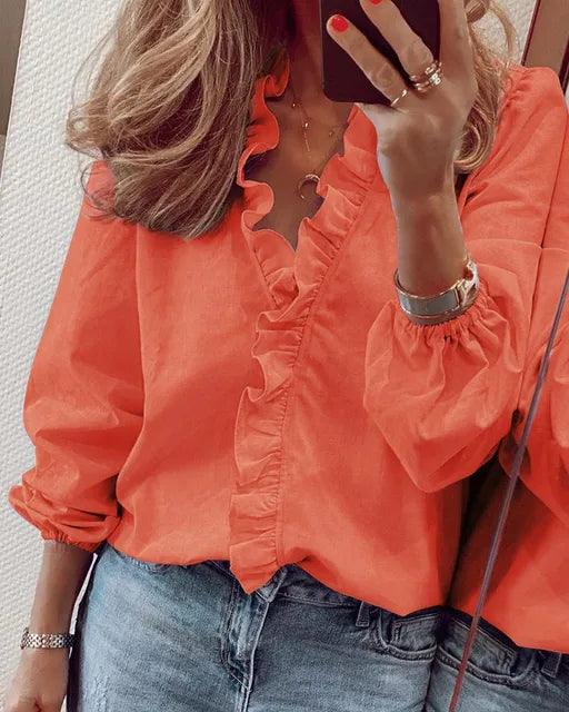 Modieuze damesblouse met vloeiende ruches, V-hals en lange mouwen, een comfortabele en elegante top.