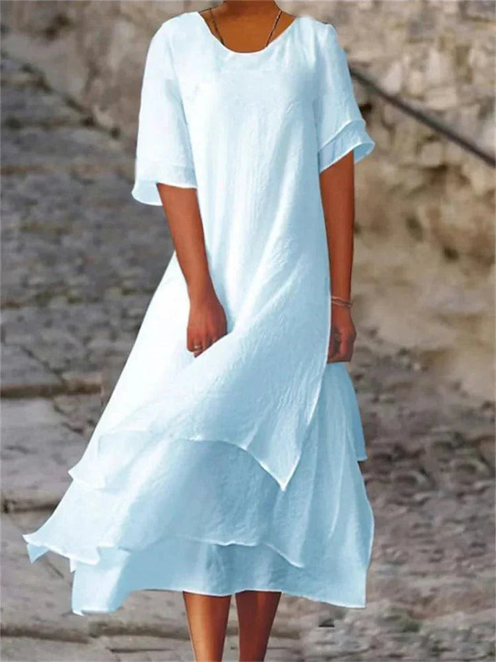 Stijlvolle dames midi jurk, gelaagd A-lijn model, elegante keuze voor elke zomerse gelegenheid.