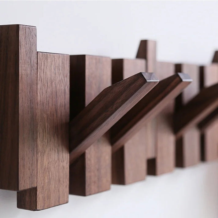 "Elegante houten kapstok met uniek pianotoetsdesign, walnoot- en beukenhout, ruimtebesparend met meerdere haken."