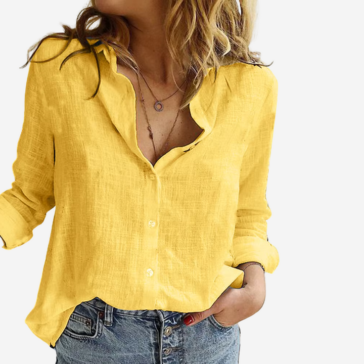 Modieuze damesblouse met reverskraag en knoopsluiting, losvallend voor optimaal comfort.