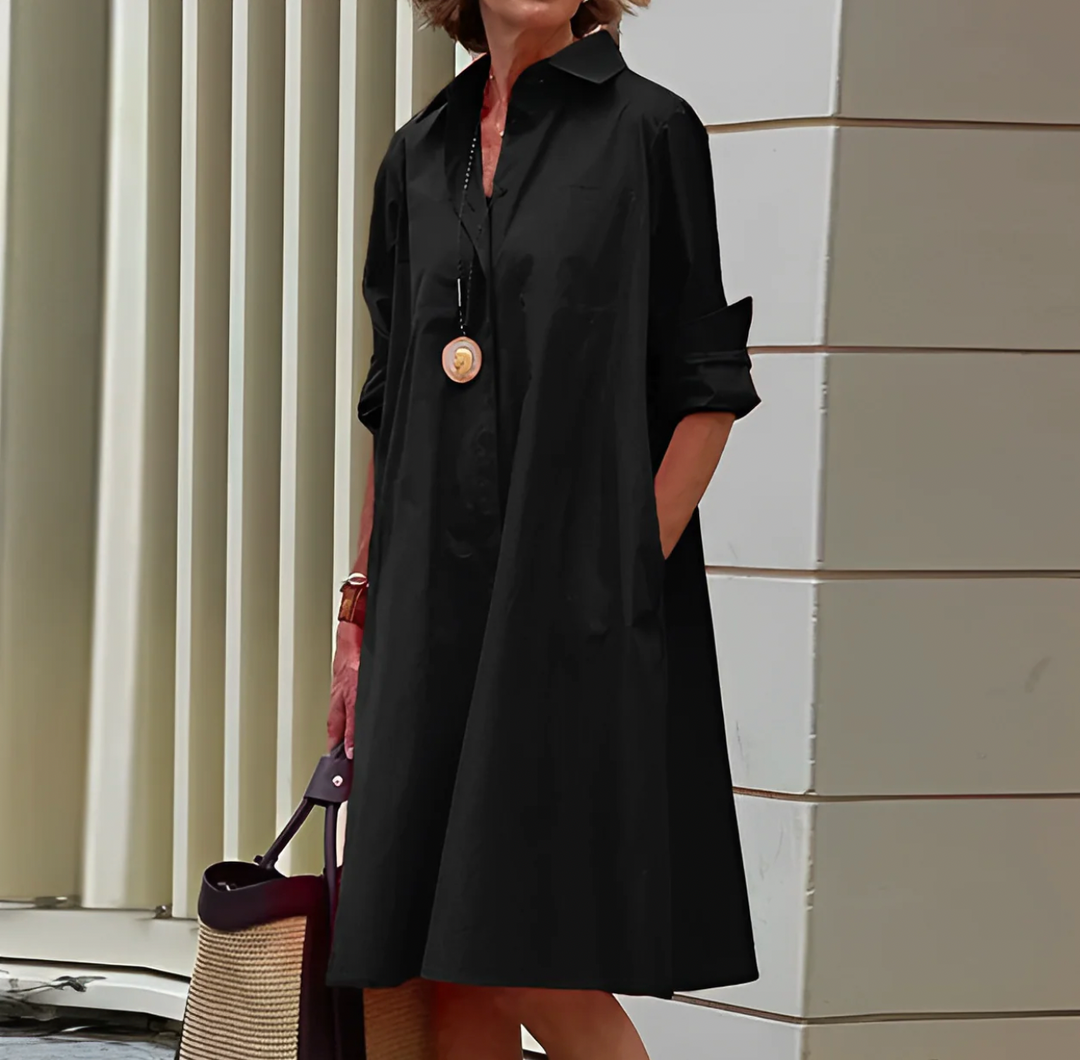 "Elegante Katarina midi jurk met lange mouwen, getailleerd silhouet en vrouwelijke uitstraling in diverse kleuren."