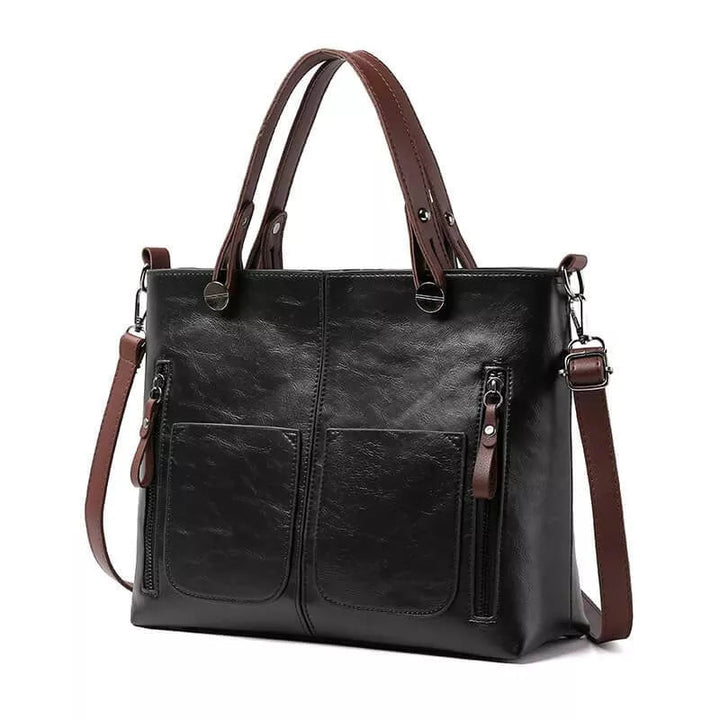 "Elegante leren schoudertas met magnetische sluiting, duurzaam bruin leer, verstelbare riem voor draagcomfort."