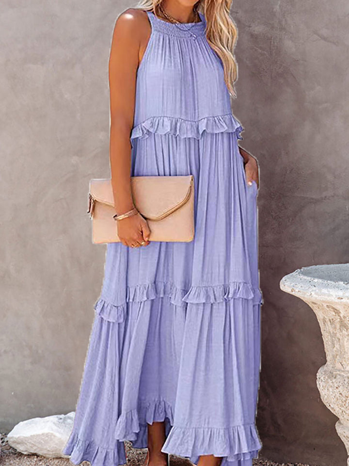 Veelzijdige mouwloze maxi-jurk met strikdetail voor dames, perfect als elegante strandjurk of feestelijke zomeroutfit.