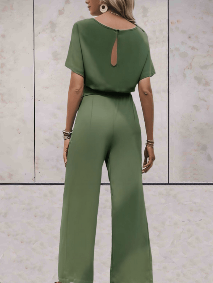 "Elegante Noa jumpsuit voor dames met wijde mouwen en striklinten, comfortabele luchtige stof, ideaal voor elke gelegenheid."