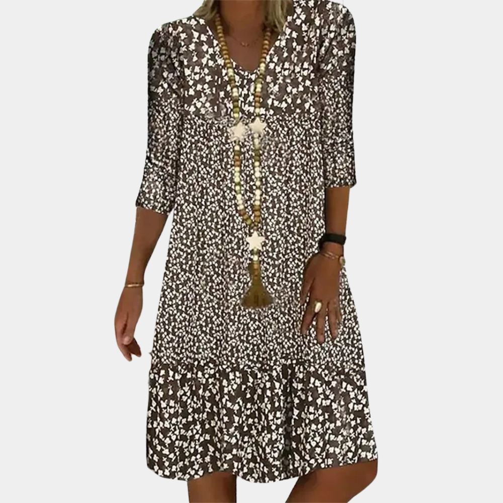 "Elegante Ottilie midi zomerjurk voor dames met V-hals, verfijnde pasvorm, ademende stof en levendige kleuren."